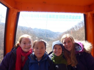 Kids on the cable car up to the Great Wall