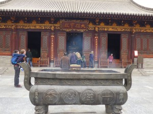 The incense burning outside one of the idol's halls.