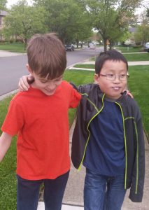 Noah and Toby walking in the neighborhood - they both are (almost always) enjoying having a brother.