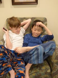 Brothers hanging out in their PJ's before church.